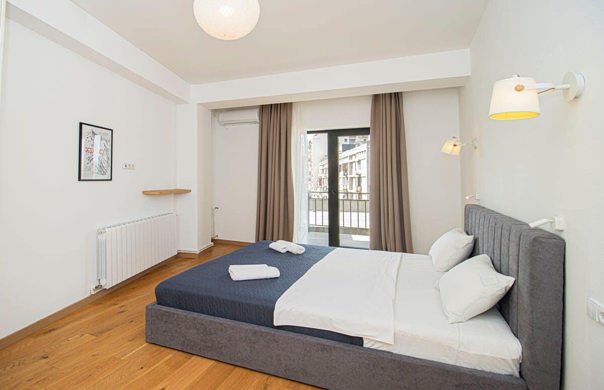 Positioned to receive plenty of natural daylight, the double bed creates a bright and airy feel in the room