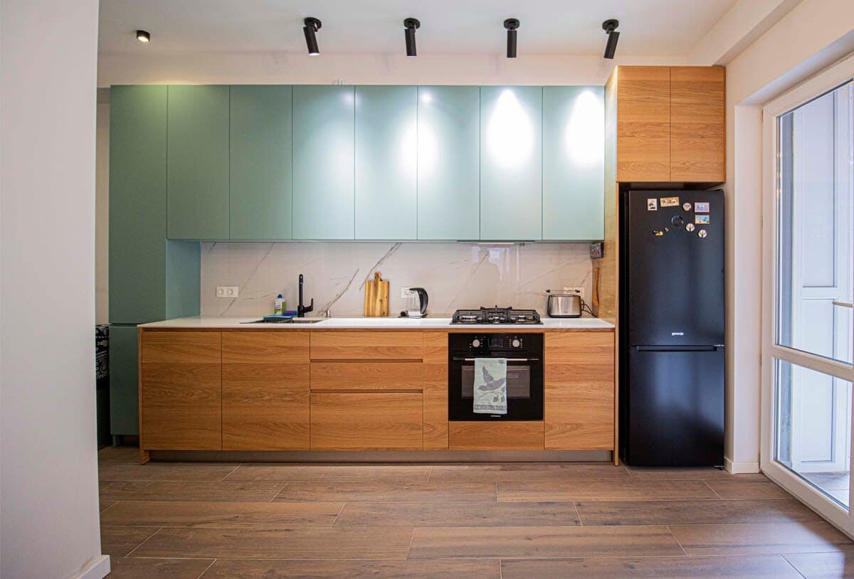Modern open kitchen seamlessly connects with the living room, offering a spacious and functional layout