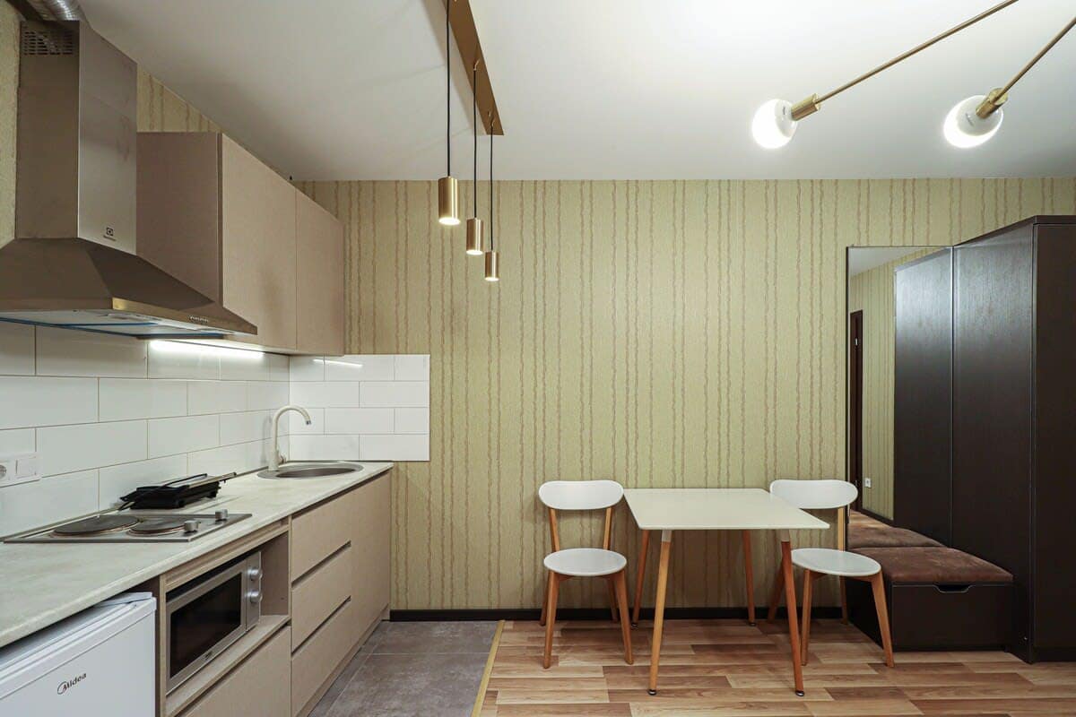 The inviting dining area features a well-sized table with comfortable seating.