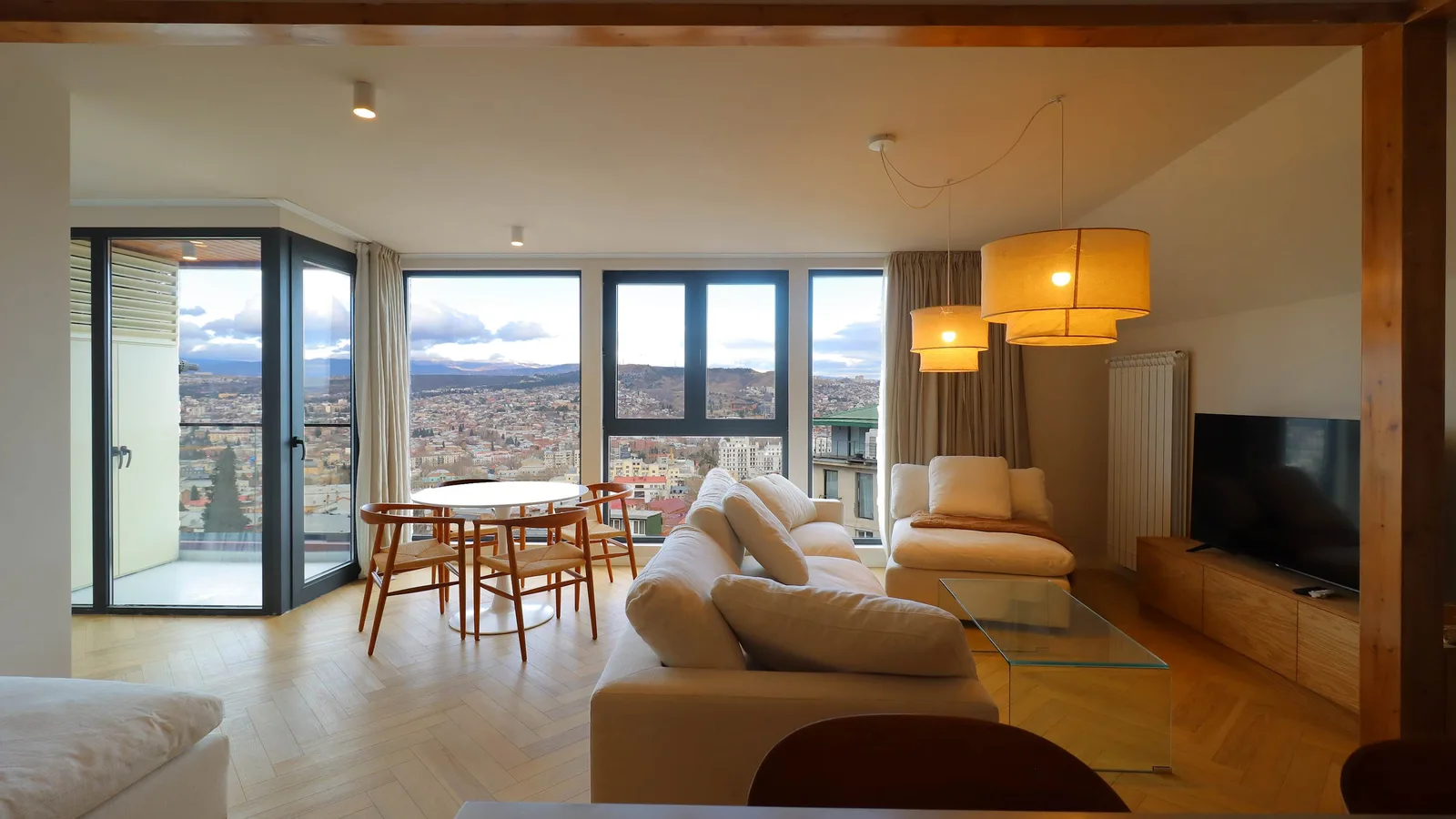 A bright modern living room with a city view