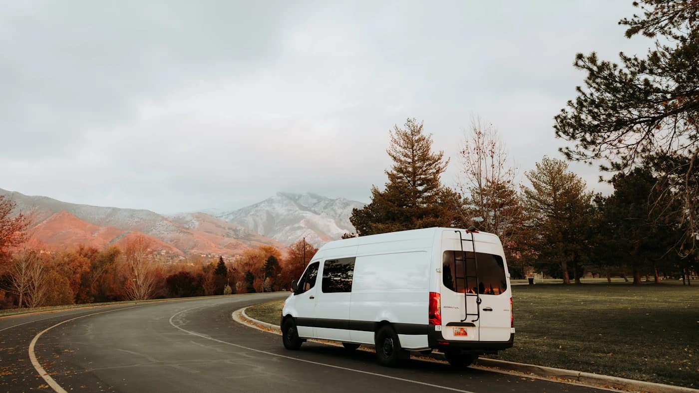 A passenger van on a mountain road outside the city